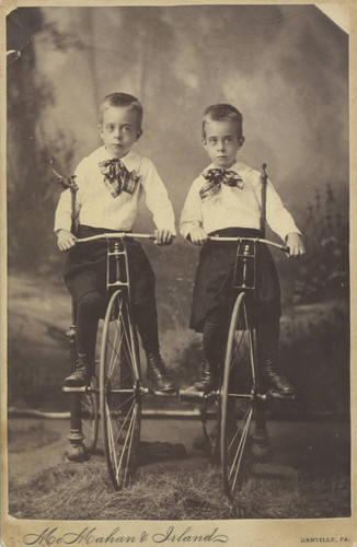 Tom and Charlie Browne on Bicycles
