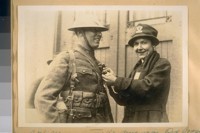 Mrs. G. H. Morrison of the American Red Cross welcoming a returning soldier from the World's War at Oakland in 1919