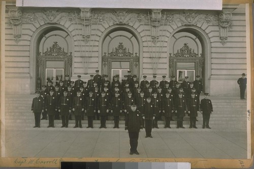 Capt. M. Carroll and a part of Co. A. - S.F.P. Dept. [San Francisco Police], 1919. Capt. M. Carroll, & Lieut. C. Coogan. Bottom Row, Left to Right: Sergt. Jas. McEnter and Officer George Burkhart, D.R. Campbell, Jas. Fogerty, Jas. Farrell, Jas. Sullivan