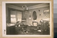 The living room at 1515-48th Ave. showing the burnt floor where the body was set on fire