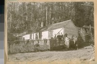 The Old home in the Heart of the Sutro Forest, back of Twin Peaks, built about 1860. Jesse B. Cook at the gate