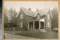 Home of the Supt. of the Cemetery Presidio, built about 1870. Jesse B. Cook in front of building