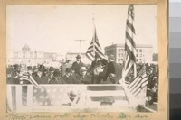 Photo same with Sup. Hooks and his white hat. [Officials in stand at groundbreaking for the new City Hall.]