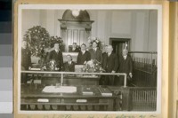 Hon. D.S. O'Brien taking his place as a Police Judge, Dec. 1920. Judge McAtee on his left in front of him with glasses on