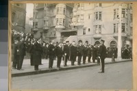Funeral of Chief D.A. White. L to R: Sect. Chas. F. Skelly, Mayor Rolph, Com. Theo. J. Roche, Capt. D. O'Brien, Com. Thos. F. Mahoney, Com. Dr. Thos. Shumate, and Com. Jesse B. Cook in front of St. Mary's Church. Capt. M. Anderson standing on the street, 1920