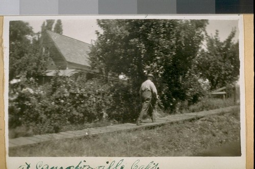 J.B. Cook at the side gate to B.T. Williams House at Camptonville - Calif. 1921