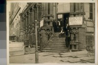 The Old Californian Safe and Deposit Trust Co. S. E. corner Montgomery and California Sts. April 1906. The man at the head of the stairs with his back against the Column is J. Walzell Brown, the Manager