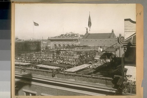 Drying fish on the roof of Building at the South East cor. Clay & Grant Ave. Oct. 9/22. See the upper story windows and roof of the Hall of Justice