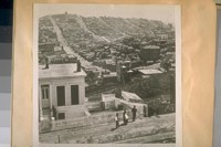 S.E. from Hyde & Lombard Sts. about 1870. The white square in this photo is the top of the old brick Greenwich St. School & the large building near it is the old North Cosmopolitan School, Kate Kennedy principal. The building on the side of Telegraph hill is the old Union St. School
