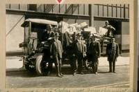 Loot recovered by S.F. [San Francisco] Police Dept. June 12/24. Loot valued at $6000.00 and taken from 3808-17th St. on the seat of Truck. Sergt. Geo. McLaughlin. Standing L. to R.: Det. Jas. Mitchell, Policeman J. Barricklo, Det. Sergt. Leo. Brenner and Policeman John Evatt