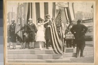 Miss Rolph at the halyard, same photo 1914. [Opening of the Panama Canal]
