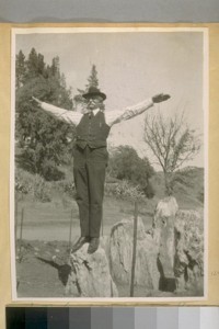 J.B. Cook at Calistoga, Napa Co. Standing on a petrified tree stump, 1920