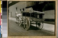 Will soon be a thing of the past as Autos will take their place. 1921. [Horse-drawn cart]