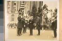 The annual inspection of the San Francisco Police Dept. with Chief W. J. O'Brien and Mayor Jas. Rolph Jr. and Commissioner Theo. J. Roche in the back of them on the Polk St. side of City Hall