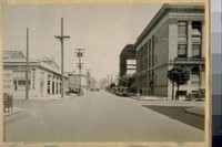 North on Franklin St. from Fell St. The building on the right is the High School of Commerce and the building in the rear is the new addition