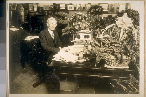 A photo of Acting Chief of Police Thos. Walsh at his desk, Hall of Justice. Dec. 30/28