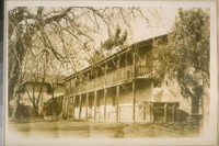Rear view of the same building, home of Don Castro. You can see the old cistern in the yard. Photo taken Feb. 22/29
