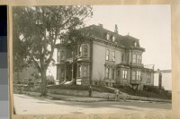 The Old Bell home, S.W. cor. Bush & Octavia Sts. In which the Old Colored Woman, Mama Pleasance [Mary Ellen Pleasant], held sway for years. House built about 1870. J.B. Cook at the corner