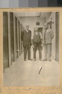 In the Vault Dept. S.U.B.&T; Co. July 7th, 1916. H.L. Whipple in uniform, A. Birchin center and Thad Kent