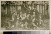 The boy with the paper box over his head is Chief of Police, now Dan J. O'Brien