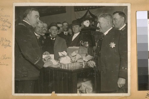 The 40-Thousand Dolr. Portland Or. Robbery, 1919. L to R: Capt. Judge, Lieut. Fitzhenry, Judge Cabanis, Mr. Fields, Off.?, Lieut. J.J. Casey, Off. H. Higgins, Off ?, Off. G. Chase, Off. Gainor