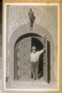 May 1932. Death Valley Scotty in entrance of his castle tower, Death Valley, Calif. Frashers Foto - Pomona