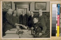 D.J. O'Brien Chief of Police receiving the $1,000.00 check from the Auto Dealers Ass. for the Chiefs of Police Convention