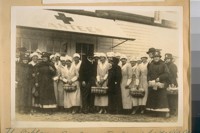 The Oakland Red Cross Workers in front of the Canteen. Mayor Davis in center, Wallace M. Alexander in the front row, second from the Mayor in the dark uniform. World War 1919
