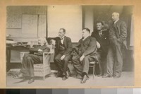 Police officials talking on the Bertillion System