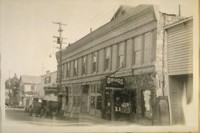 This is the Scribners' Drug Store on the Main St. Angeles Camp, Calaveras Co. Calif. August 9/28. The front has been changed by being resurfaced. The old side walls still show. Built in 1850