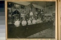 The Old Bank Exchange in the Old Montgomery Block, S.E. cor. Washington & Montgomery Sts. showing the Propritor [sic] Duncan Nichols with the gray hair in the center