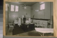 Emergency hospital at the auditorium, Democratic Convention, June 28th to July 6th Inc. 1920. Nurse at foot of bed is Mrs. Richard Jose, wife of the great tenor