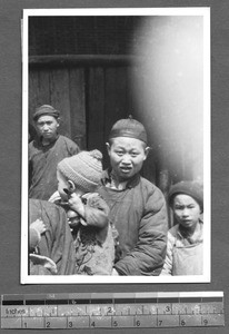 Tibetan people on street, Tibet, China, ca.1941