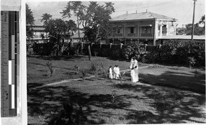Maryknoll Sisters walking in their convent's garden, Malabon, Philippines, January 1, 1928