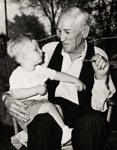 Ben de Crevecoeur with child on lap in Banning, California