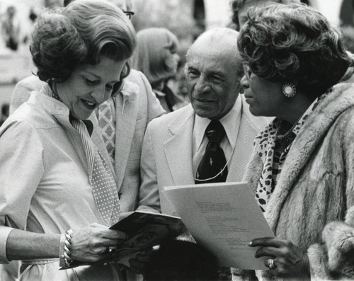 Betty Ford with two guest during foster grandparent ceremony, 1975