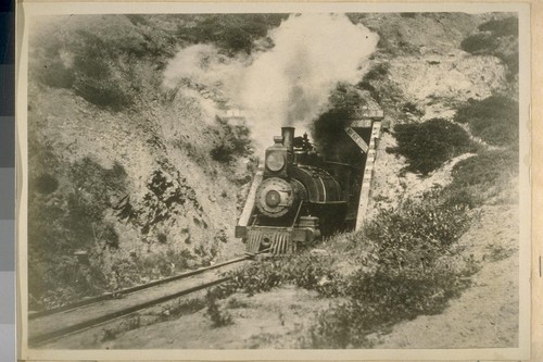 The Old Steam Train passing out of the tunnel near lands end. 1895