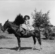 "Nellie Chase on Horse"