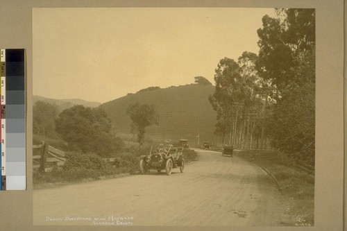 Dublin Boulevard, near Hayward, Alameda County [shows automobiles]