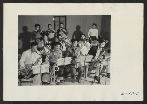 Swing Band practice--a strictly hep gang directly in the groove. The boys play at mess hall dances which generally end up in a straight jitterbug contest. Photographer: Parker, Tom Heart Mountain, Wyoming