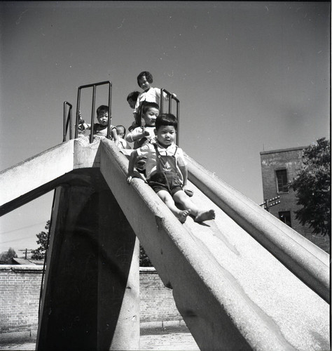 Children playing on a slide in Tapgol Park, Seoul