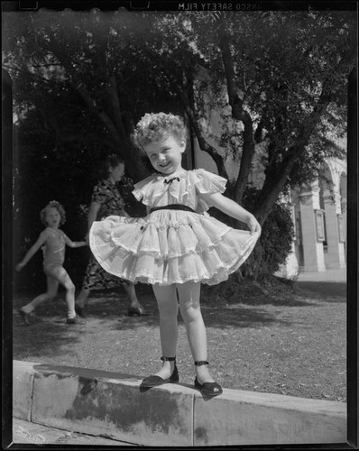 Helena Burnett in a dress and sandals, 1947-1950