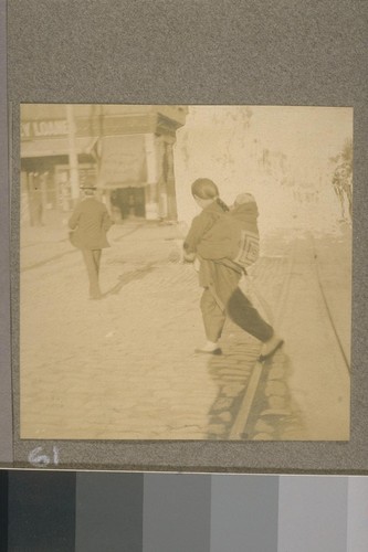 [Unidentified woman and child in street.]