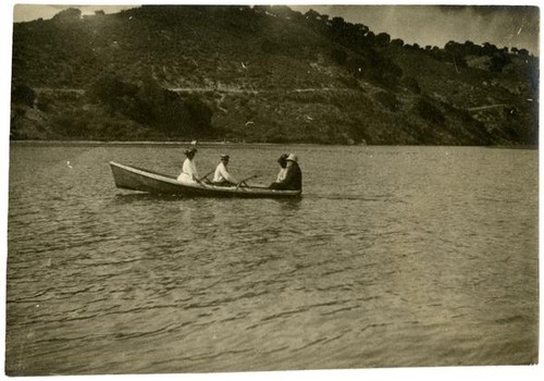 [Group in small row boat]