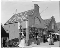 Shoppers in the street outside an art store in Holland, 1929