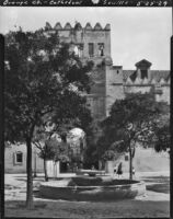 Patio de los Naranjos, view of a fountain and gateway in wall, Seville, Spain, 1929