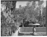 Wright Saltus Ludington residence, view of wisteria lined terrace with round pedestal table, Montecito, 1931