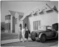 Laura La Plante residence, angled front view of house with Laura La Plante and 2 women, Beverly Hills, 1926