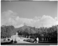 Gardens at the Royal Palace of La Granja de San Ildefonso, view of stairs leading up from a small pool and statue, San Ildefonso, Spain, 1929