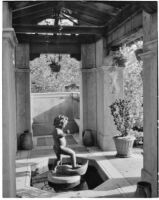 W. R. Dunsmore residence, view towards fountain with putto in pergola, Los Angeles, 1930